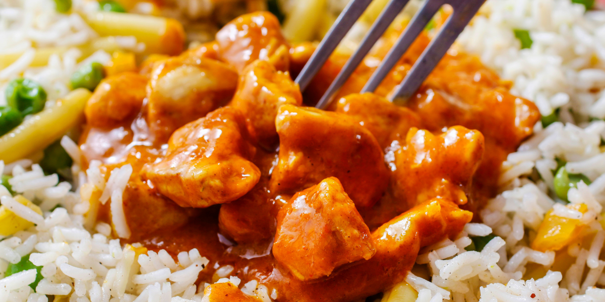 orange chicken on a bed of rice